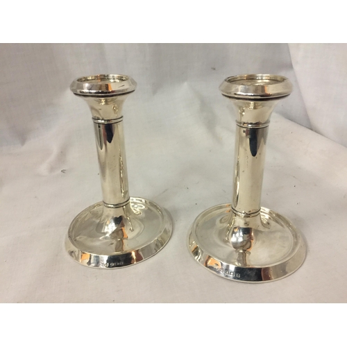 34 - TWO HALLMARKED BIRMINGHAM SILVER CANDLE STICKS