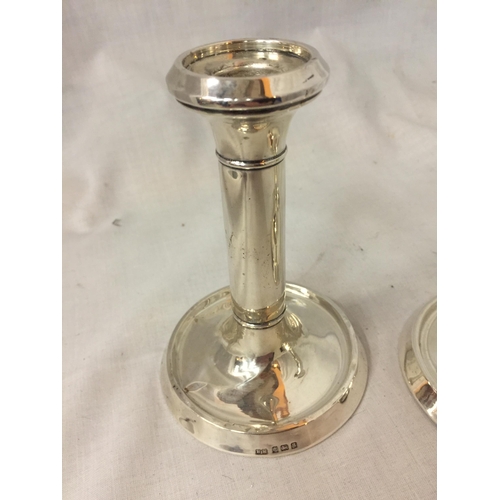 34 - TWO HALLMARKED BIRMINGHAM SILVER CANDLE STICKS