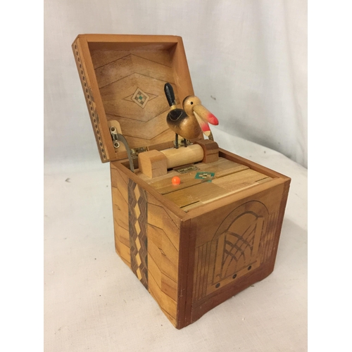 37 - A MARQUETRY INLAID CIGARETTE BOX WITH A TOUCAN STYLE WOODEN BIRD