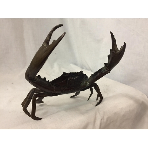 38 - A POSSIBLY BRONZE RAISED CRAB ORNAMENT, ARM A/F