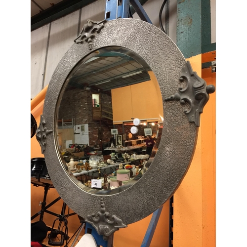 42 - A PEWTER ARTS & CRAFTS CIRCULAR MIRROR WITH BEVEL EDGE, DIAMETER APPROX 72CM