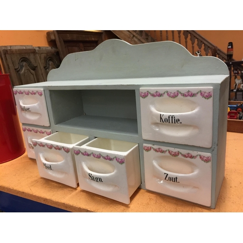 47 - A DUTCH KITCHEN SET OF SIX PORCELAIN CONDIMENT DRAWERS IN WOODEN FRAME