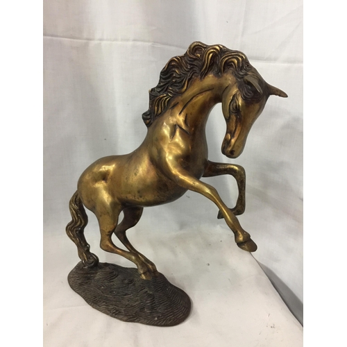 52 - A BRASS REARING HORSE ORNAMENT, HEIGHT 30CM