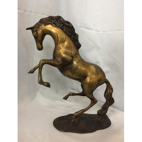 52 - A BRASS REARING HORSE ORNAMENT, HEIGHT 30CM