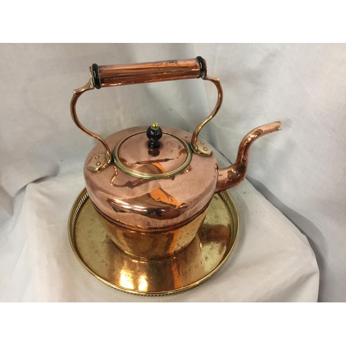 55 - A LARGE COPPER KETTLE, HEIGHT 34CM, WIDTH 34CM TOGETHER WITH BRASS DECORATIVE TRAY DIAMETER 33CM