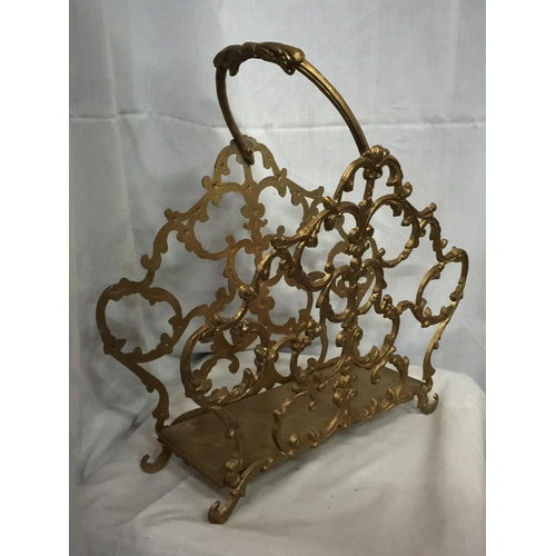 63 - AN ORNATE GILDED MAGAZINE RACK