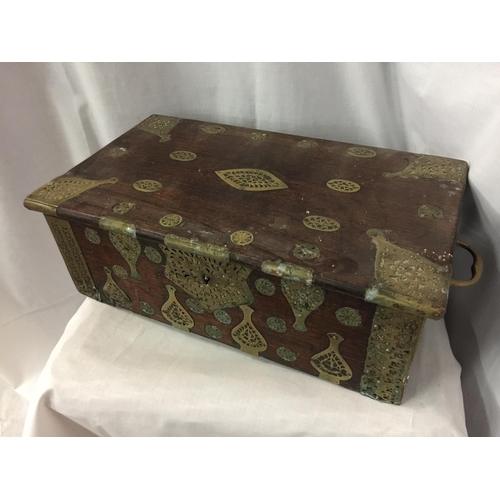 7 - A DUTCH EAST INDIES PADOUK WOOD TRAVELLING BOX WITH BRASS DECORATION AND HANDLES