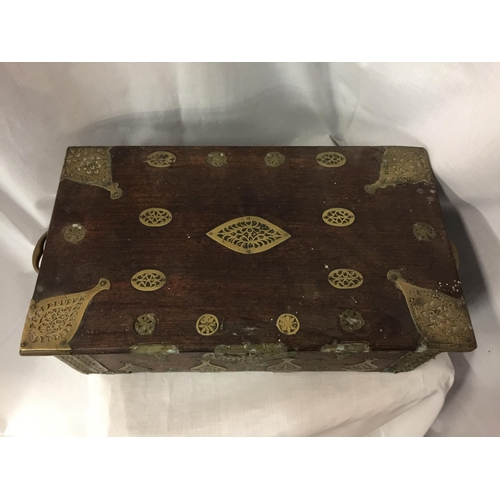 7 - A DUTCH EAST INDIES PADOUK WOOD TRAVELLING BOX WITH BRASS DECORATION AND HANDLES