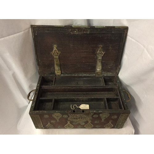 7 - A DUTCH EAST INDIES PADOUK WOOD TRAVELLING BOX WITH BRASS DECORATION AND HANDLES