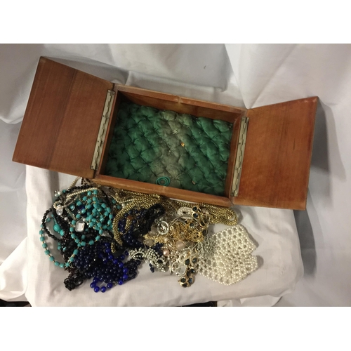 73 - A WOODEN BOX WITH A DOUBLE HINGED TOP AND COSTUME JEWELLERY