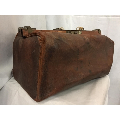 74 - A VINTAGE GLADSTONE BAG WITH THE INITIALS J J