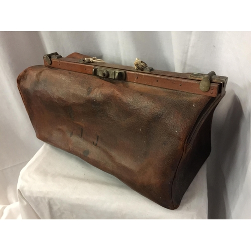 74 - A VINTAGE GLADSTONE BAG WITH THE INITIALS J J