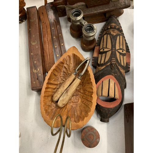 162 - A QUANTITY OF TREEN ITEMS TO INCLUDE A MASK, ANTELOPE, NUTCRACKERS PLUS A PAIR OF FIELD GLASSES