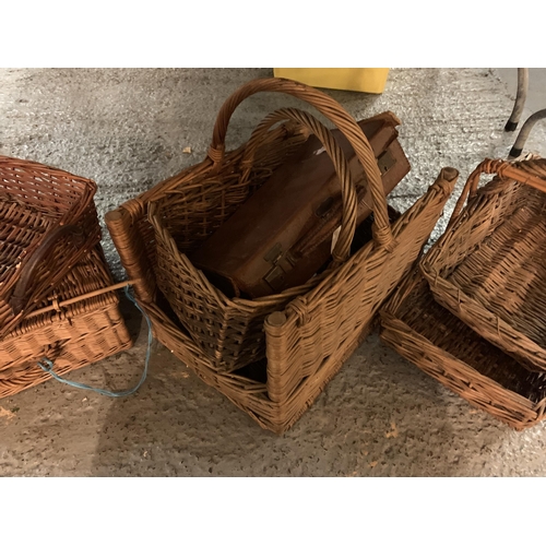 185 - FIVE WICKER BASKETS, A PICNIC BASKET AND A SMALL LEATHER SUITCASE