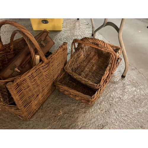 185 - FIVE WICKER BASKETS, A PICNIC BASKET AND A SMALL LEATHER SUITCASE