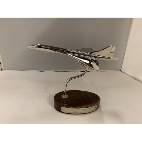 188 - A CHROME MODEL OF CONCORDE ON A WOODEN PLINTH HEIGHT 17CM