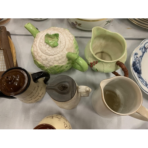 217 - POTTERY ITEMS TO INCLUDE A CAULIFLOUR TEAPOT, TORQUAYWARE, CARLTONWARE ETC