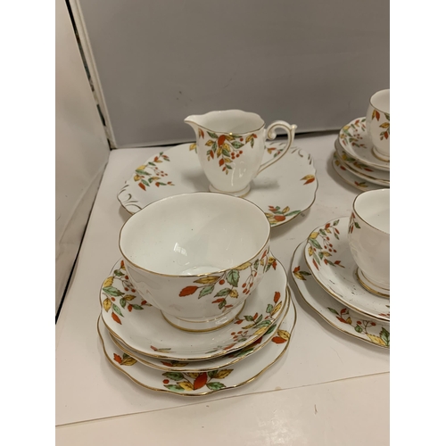 226 - BELL CHINA CUPS, SAUCERS, PLATES, ETC IN A DELICATE ORANGE, YELLOW AND GREEN FLORAL PATTERN