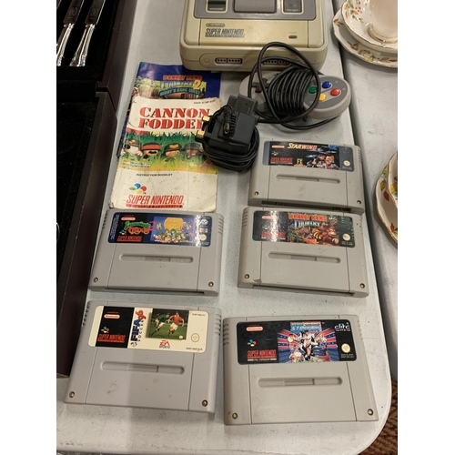 227 - A VINTAGE SUPER NINTENDO ENTERTAINMENT SYSTEM WITH FIVE GAMES; FIFA 96, STRIKER, DONKEY KONG, LEMMIN... 