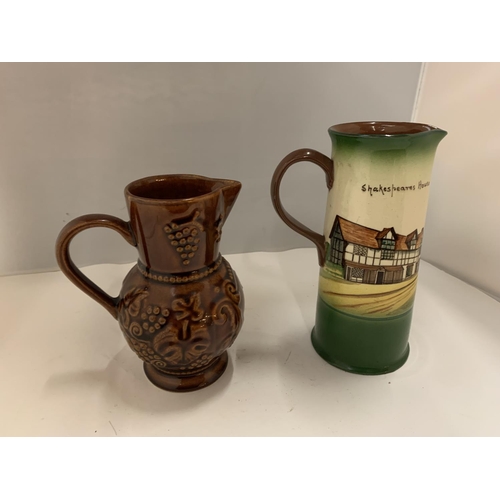 101 - TWO POTTERY JUGS, ONE BEING A DECORATION OF SHAKESPEARE'S HOUSE AND THE OTHER A HALF PINT EMBOSSED B... 