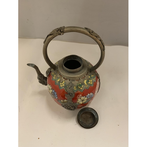 102 - AN ORIENTAL POTTERY AND METAL TEAPOT DECORATED IN RED WITH YELLOW AND BLUE FLOWERS