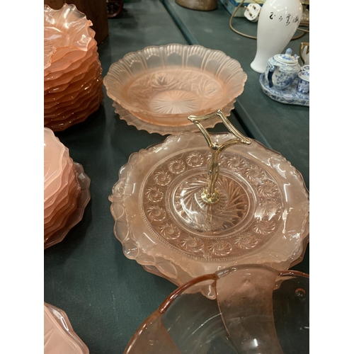 105 - A QUANTITY OF PINK CARNIVAL STYLE WARE TO INCLUDE PLATES, BOWLS AND A CAKE STAND