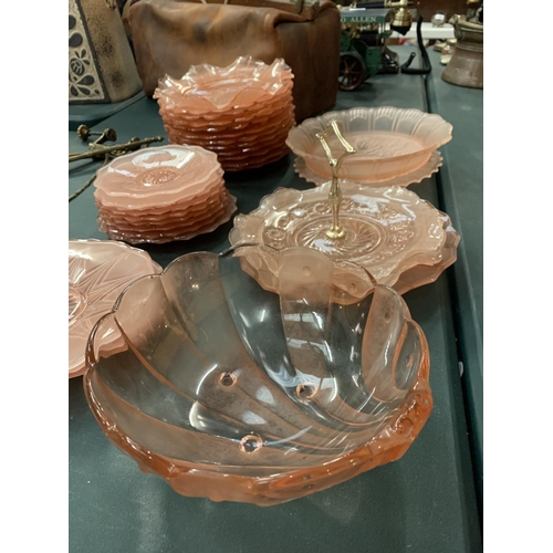 105 - A QUANTITY OF PINK CARNIVAL STYLE WARE TO INCLUDE PLATES, BOWLS AND A CAKE STAND