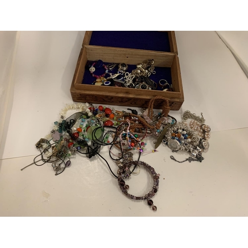 110 - A DECORATIVE WOODEN BOX OF COSTUME JEWELLERY