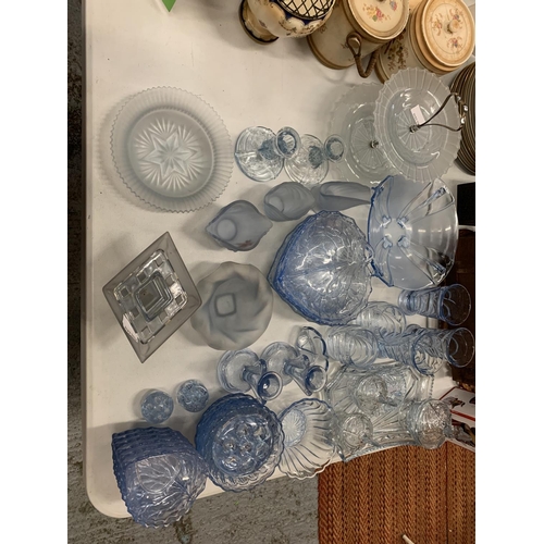 138 - A LARGE QUANTITY OF BLUE COLOURED GLASSWARE TO INCLUDE LEAF SHAPED SERVING DISHES, BOWLS, GLASSES, C... 