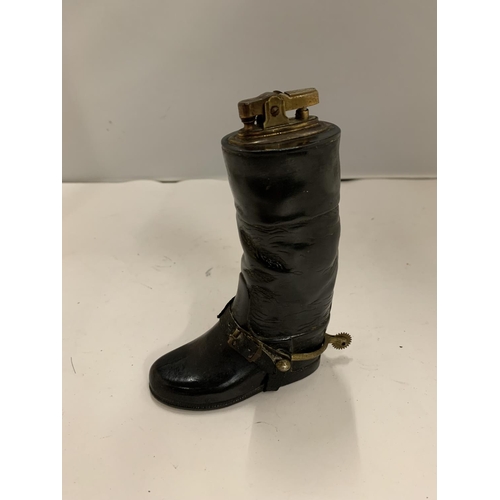 142 - A CIGARETTE LIGHTER IN THE SHAPE OF A RIDING BOOT