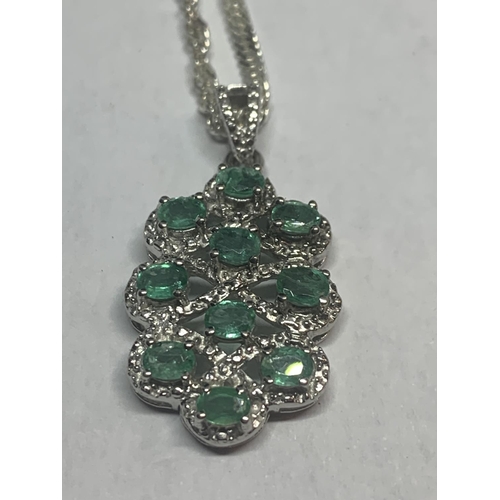 509 - TWO SILVER NECKLACES WITH GREEN STONE PENDANTS