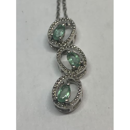 509 - TWO SILVER NECKLACES WITH GREEN STONE PENDANTS