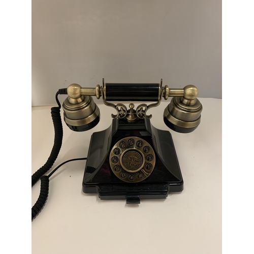 82 - A VINTAGE STYLE BLACK AND BRASS PUSH BUTTON TELEPHONE WITH A PULL OUT NUMBER TRAY