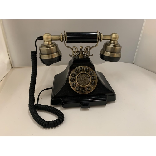 82 - A VINTAGE STYLE BLACK AND BRASS PUSH BUTTON TELEPHONE WITH A PULL OUT NUMBER TRAY