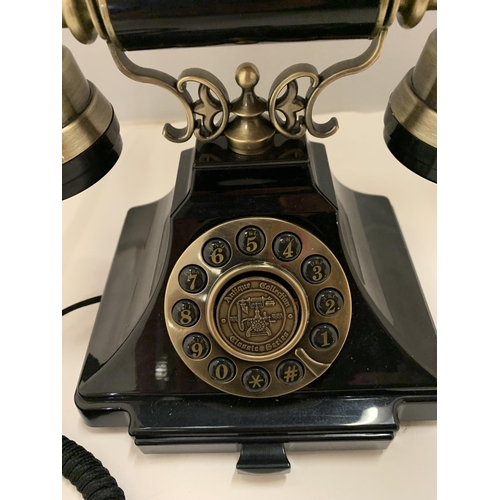 82 - A VINTAGE STYLE BLACK AND BRASS PUSH BUTTON TELEPHONE WITH A PULL OUT NUMBER TRAY