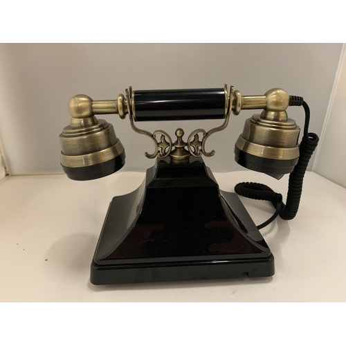 82 - A VINTAGE STYLE BLACK AND BRASS PUSH BUTTON TELEPHONE WITH A PULL OUT NUMBER TRAY