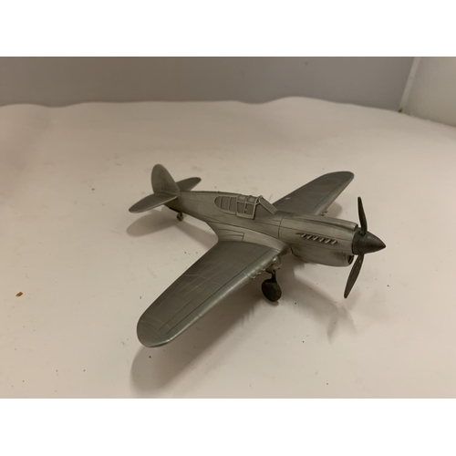 84 - A PEWTER REPLICA OF A CURTISS P-40 WARHAWK AMERICAN FIGHTER AIRCRAFT