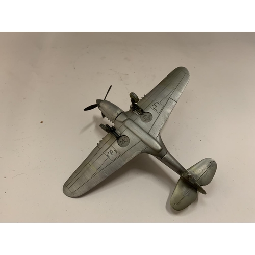 84 - A PEWTER REPLICA OF A CURTISS P-40 WARHAWK AMERICAN FIGHTER AIRCRAFT