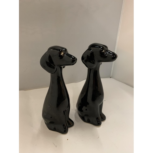 91 - A PAIR OF KITSCH BLACK DOGS