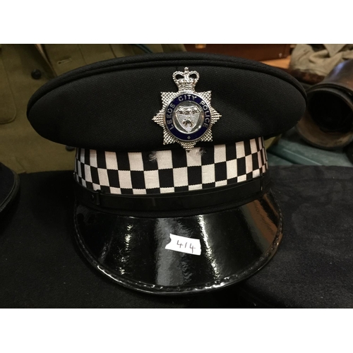 414 - FIVE ASSORTED BRITISH POLICE HATS, TO INCLUDE GUERNSEY, LEEDS CITY, SCOTLAND ETC