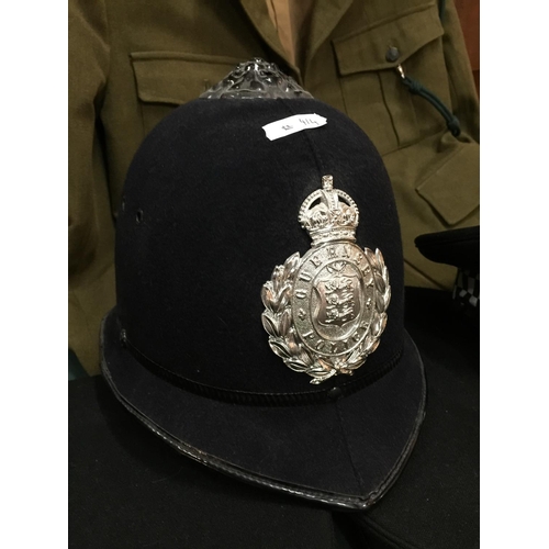 414 - FIVE ASSORTED BRITISH POLICE HATS, TO INCLUDE GUERNSEY, LEEDS CITY, SCOTLAND ETC