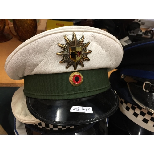 415 - NINE ASSORTED POLICE HATS, TO INCLUDE QUEENSLAND, GERMAN U.S. ETC