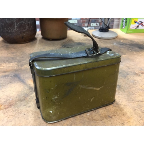 445 - A GREEN PAINTED GAS MASK TIN