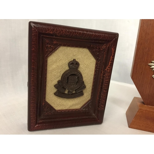 447 - A WOODEN MOUNTED ROYAL SCOTS BADGE AND A FRAMED ROYAL ARMY ORDINANCE CORPS BADGE (2)