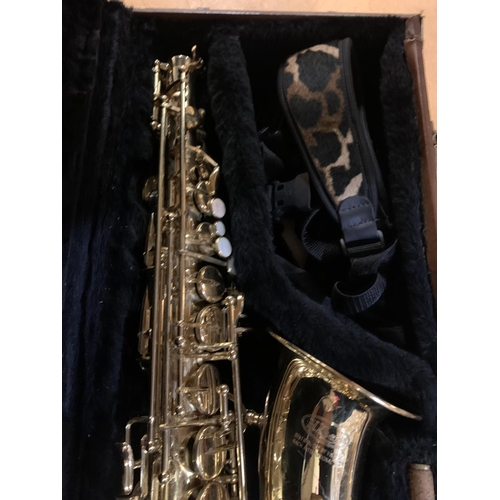 486 - A GOLD LACQUERED E.L. RHART SAXOPHONE IN CASE