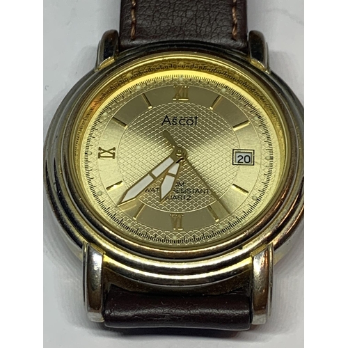 526 - AN ASCOT CALENDAR WRIST WATCH WITH BROWN LEATHER STRAP SEEN WORKING BUT NO WARRANTY