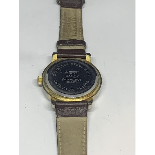 526 - AN ASCOT CALENDAR WRIST WATCH WITH BROWN LEATHER STRAP SEEN WORKING BUT NO WARRANTY