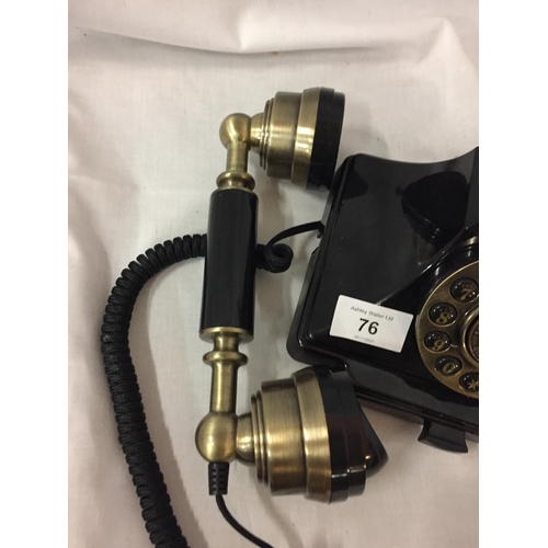 76 - A VINTAGE STYLE BLACK AND BRASS PUSH BUTTON TELEPHONE WITH A PULL OUT NUMBER TRAY