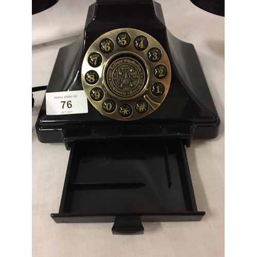 76 - A VINTAGE STYLE BLACK AND BRASS PUSH BUTTON TELEPHONE WITH A PULL OUT NUMBER TRAY