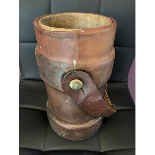 466 - A MILITARY LEATHER POWDER FLASK